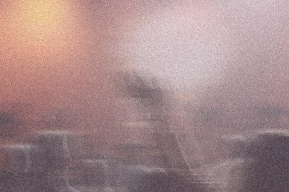 Concert crowd in a peach haze