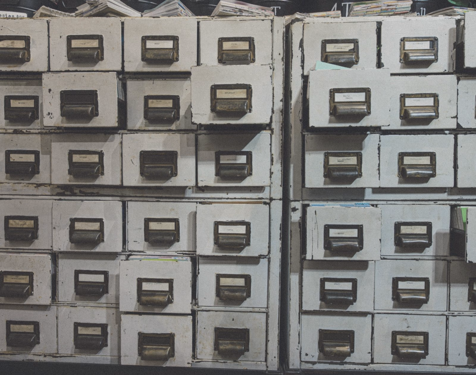 Rows of old labelled filing drawers